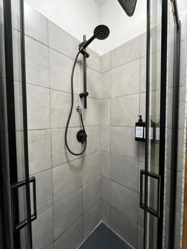 a shower with a shower head in a bathroom at Affittacamere San Pietro in Tempio Pausania