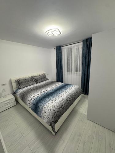 Postel nebo postele na pokoji v ubytování Apartament Acasă în Bucovina