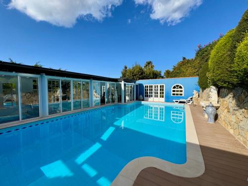 a large swimming pool in a house at Casa Star in Ericeira