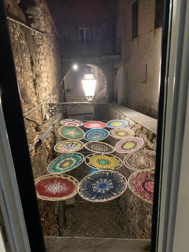 a group of colorful plates sitting on a floor at B&B Francesca in Serrone