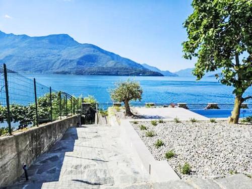 a path next to a body of water at Apartment Lago Infinito by Interhome in Gravedona