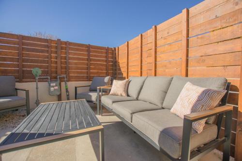 a couch and a table on a patio at Terracotta Suite at ArnoTriplex! Hot Tub and Pet Friendly! in Albuquerque