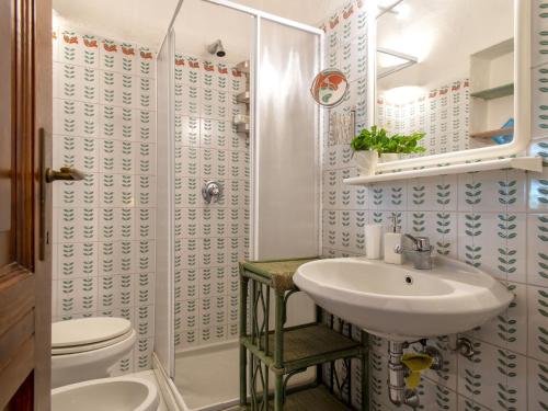a bathroom with a sink and a toilet at Villa La Giulia Porto Cervo by Interhome in Arzachena