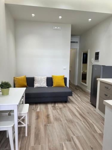 a living room with a couch and a table at Ines Apartments in Giardini Naxos