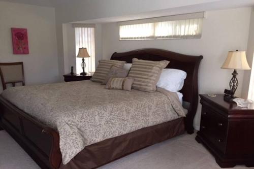 a bedroom with a large bed and two night stands at Sunny Breezes Villa in Placida