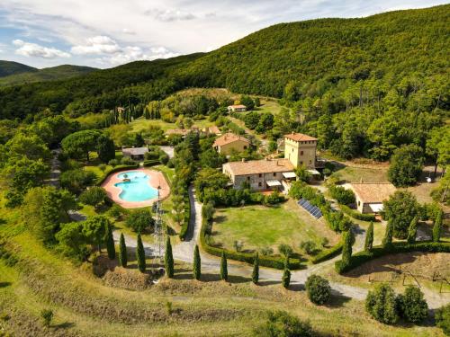 an estate in the hills with a swimming pool at Apartment Gufo-31 by Interhome in Podere Dottrina