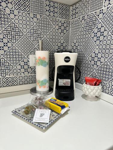 a coffee maker on a counter in a kitchen at Ines Apartments in Giardini Naxos
