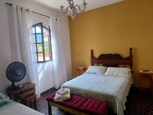Ένα ή περισσότερα κρεβάτια σε δωμάτιο στο Flat Tiradentes