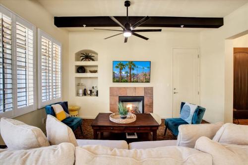 a living room with a couch and a fireplace at Picturesque 1BR in Legacy Villas near Main Pool #A in La Quinta