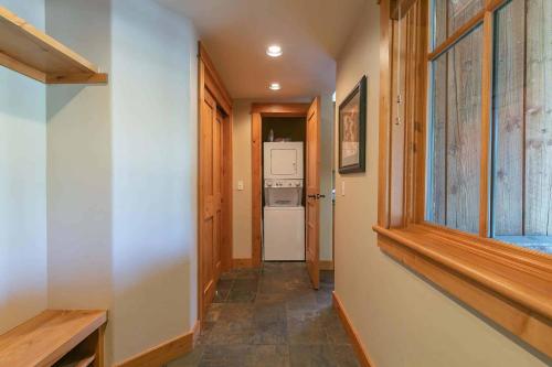 a hallway with a washer and dryer in a house at Fairway Drive 13151 by East West Hospitality in Truckee