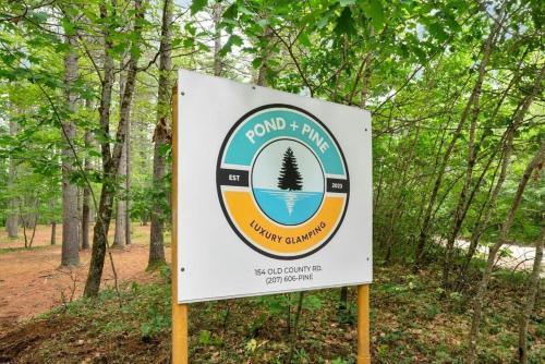 a sign for a park with a pine tree on it at A-Frame Retreat with Inviting Hot Tub in Oxford