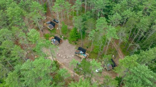 an overhead view of a group of tents in the woods at A-Frame Retreat with Inviting Hot Tub in Oxford