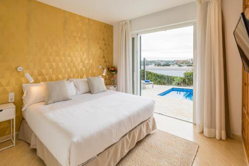 Postel nebo postele na pokoji v ubytování FLOR Villa Marina - Puerto Mahón