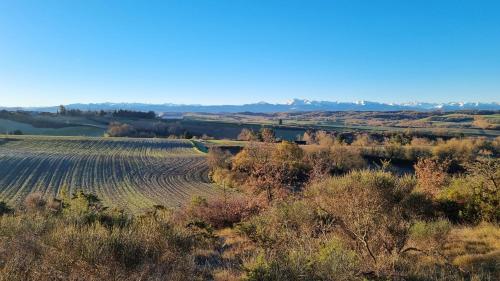 a view of a field from the top of a hill at L'Orchidée chambres d'hôtes in Hounoux