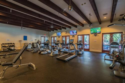 a fitness room with treadmills and cardio machines at Remodeled Desert Hideaway #A in La Quinta