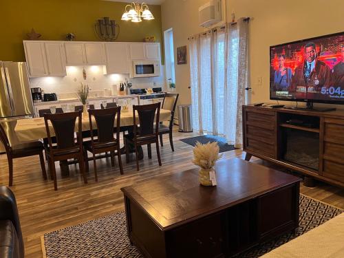 a living room with a kitchen and a dining room at Stunning Empire State 3 BR'S in Union City