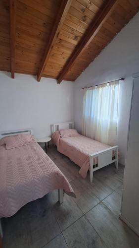 Ένα ή περισσότερα κρεβάτια σε δωμάτιο στο Casa Villa Naturaleza