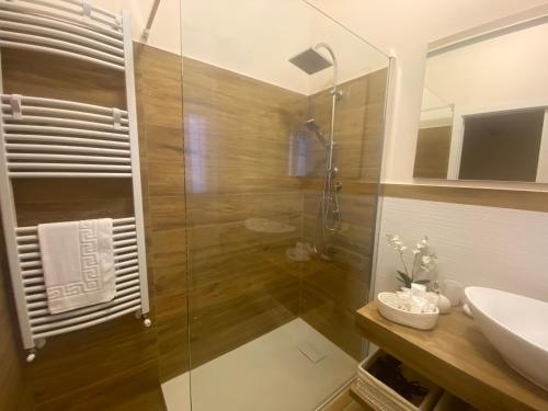 a bathroom with a shower and a sink at Cicero’s - Intero alloggio in Castelbuono