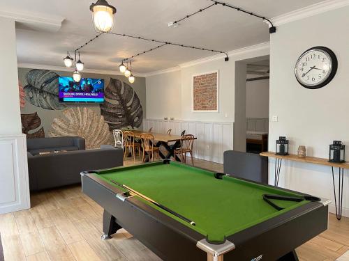 a living room with a pool table in it at 3 WIOSŁA Brzozowa Zatoka in Brenno