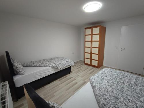 Ένα ή περισσότερα κρεβάτια σε δωμάτιο στο Stadt Ap Heidenheim