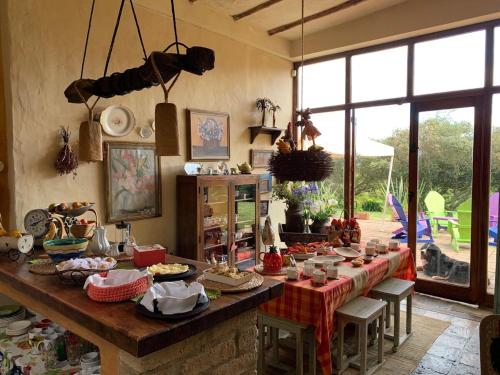 a room with a long table with food on it at Casa de Campo en Tabio Cundinamarca in Tabio