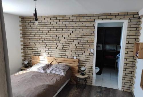 Postel nebo postele na pokoji v ubytování Le Ranch - chambres d'hôtes - proche centre ville