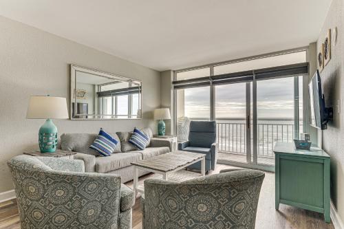 a living room with a couch and chairs and a television at Oceanfront North Myrtle Beach Gem Pools Access! in Myrtle Beach