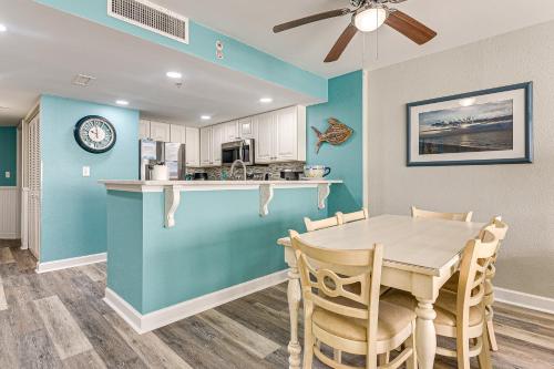 a kitchen and dining room with a table and chairs at Oceanfront North Myrtle Beach Gem Pools Access! in Myrtle Beach