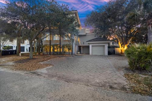 a large house with a driveway in front of it at AV9-02: 9 2nd Avenue in Isle of Palms