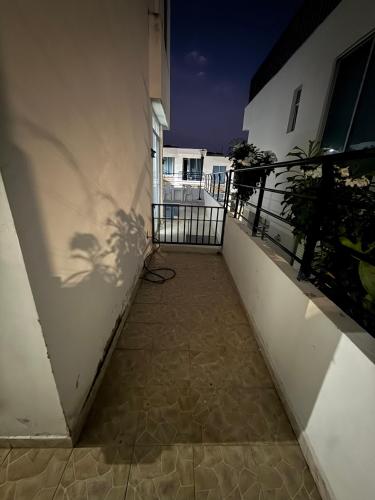 a shadow of a plant on the side of a building at Casa Quinta con piscina Girardot- Via el Peñón in Girardot