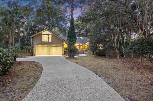 a driveway leading to a house with a garage at SI2995: 2995 Seabrook Island Rd. in Seabrook Island