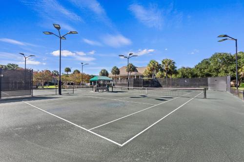 a parking lot with a tennis court at SI2995: 2995 Seabrook Island Rd. in Seabrook Island