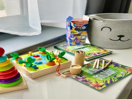 a table with some toys on top of a table at Villa in Doksy near Macha Lake in Doksy