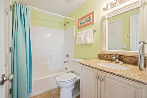 a bathroom with a toilet and a sink and a shower at SL912: 912 Sealoft in Seabrook Island