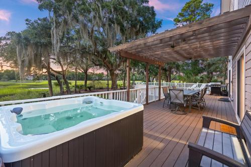 a hot tub on the deck of a house at MG3080: 3080 Marshgate in Seabrook Island