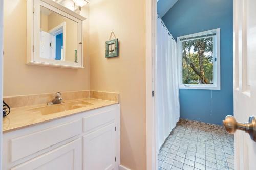 a bathroom with a sink and a window at MG3080: 3080 Marshgate in Seabrook Island