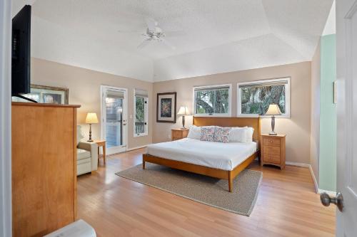 a bedroom with a bed and a flat screen tv at MG3080: 3080 Marshgate in Seabrook Island