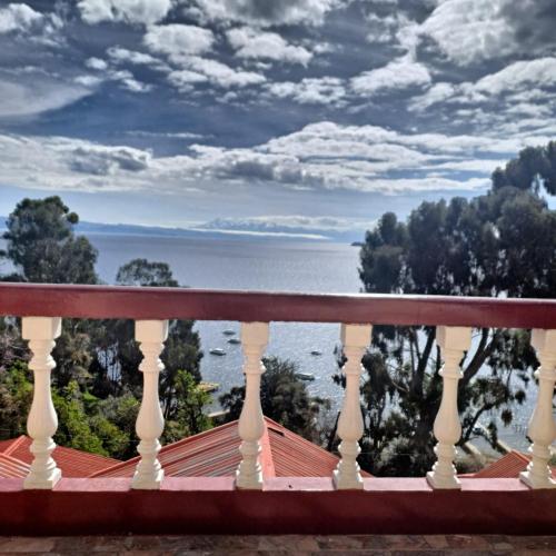 a view of the ocean from a balcony at Palacio del Inca Lodge in Comunidad Yumani