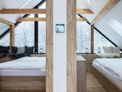 Villa in eladná with Outdoor Cinema & Whirlpoolにあるベッド