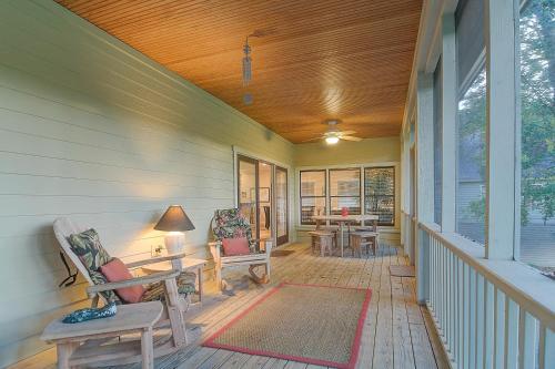 a porch with chairs and tables on a house at SM04: 4 Silver Moss in Kiawah Island