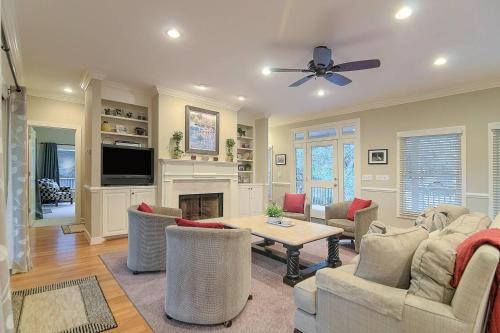 a living room with a table and a fireplace at SM04: 4 Silver Moss in Kiawah Island