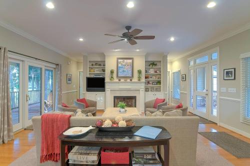 a living room with a couch and a fireplace at SM04: 4 Silver Moss in Kiawah Island
