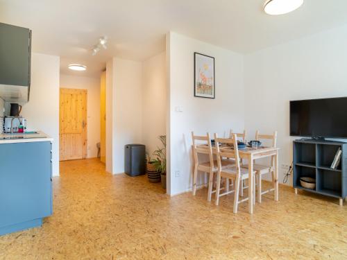 a kitchen and dining room with a table and chairs at Villa in Desná near Ski Resorts in Desná
