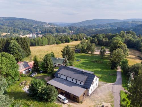 an aerial view of a building in a field at Villa in Desná near Ski Resorts in Desná