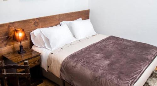 Postel nebo postele na pokoji v ubytování Hotel Casa Fierro Cusco