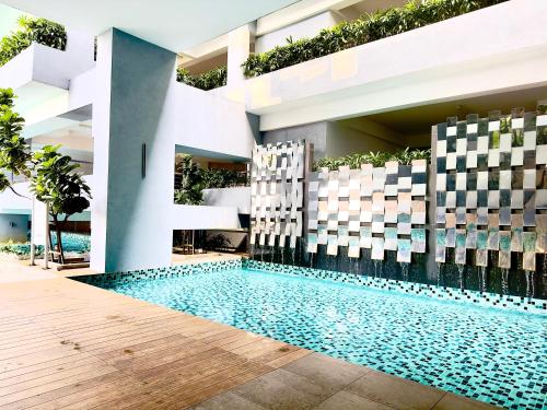 a swimming pool in the middle of a building at Studio Room at Neu Suites, Jalan Ampang KL in Kuala Lumpur