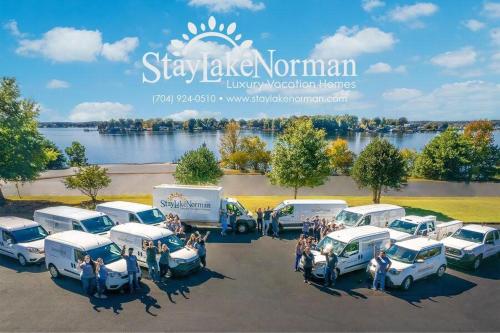 a group of cars parked in a parking lot at Elysian Shores w/Heated Pool & Optional Boat Rental in Mooresville
