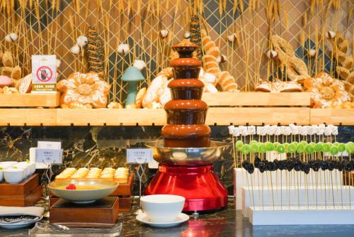 a counter with a red blender and some bread at Broadway Mansions Hotel - On the Bund - Journey Through Time Old Shanghai Republic Dreams in Shanghai