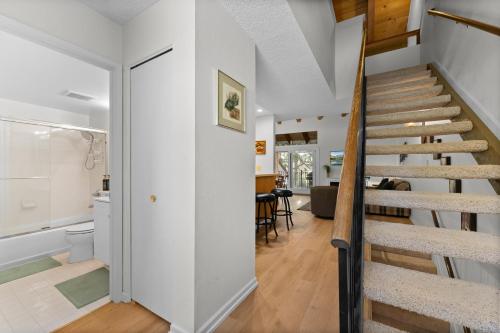 a staircase in a house with a living room at Lake Escape in Carnelian Bay
