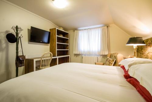 Pousada Casa Gialla by Concavusにあるベッド